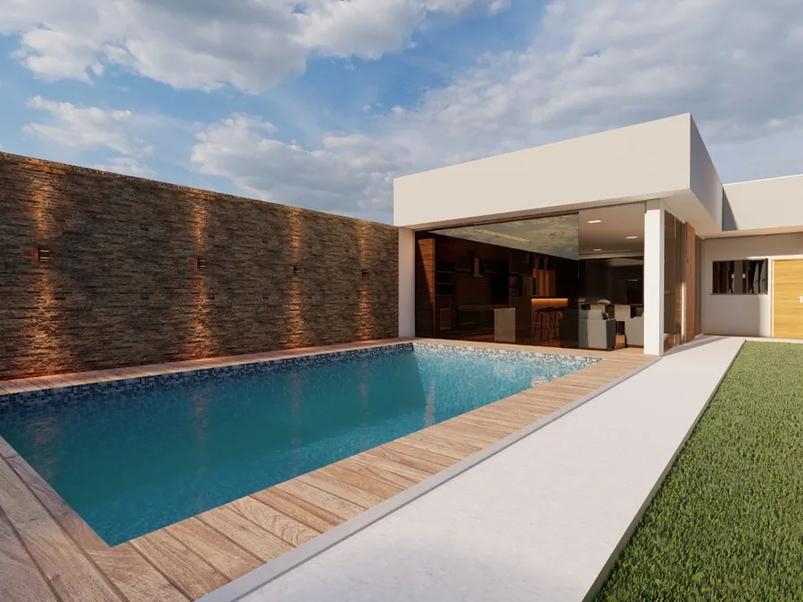Piscina com deck e muro em pedra